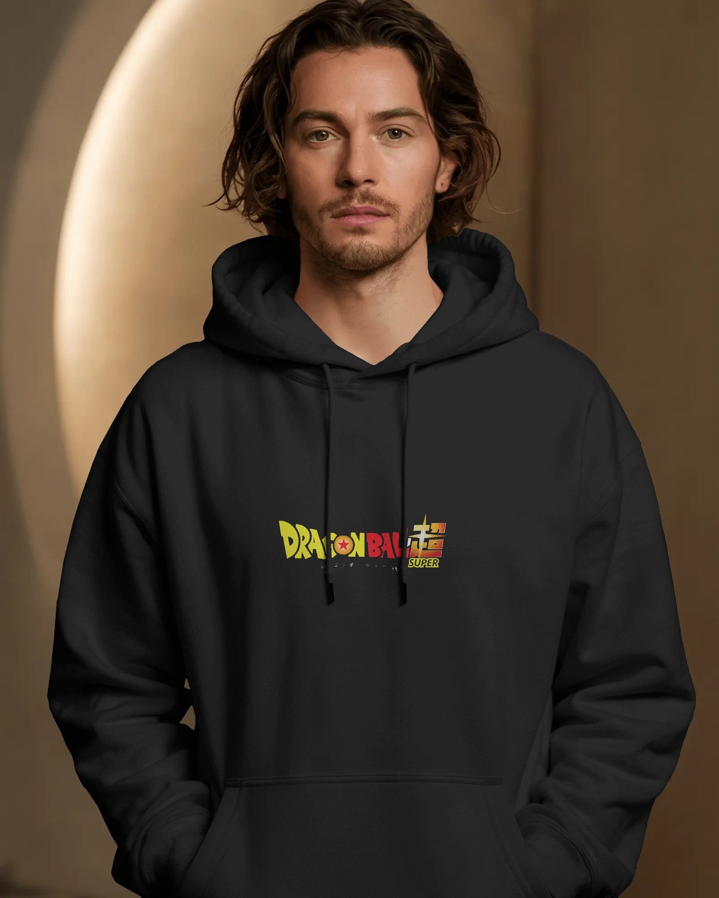 Man wearing a black hoodie with 'Dragon Ball' logo against a brown background