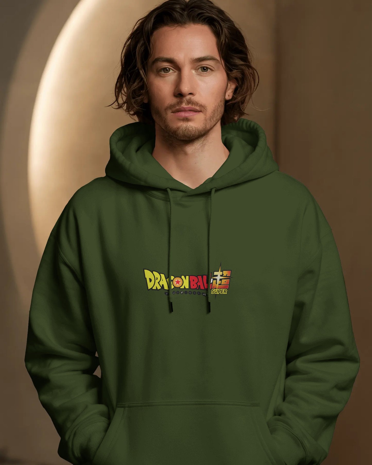 Man wearing a green hoodie with a colorful logo against a brown background